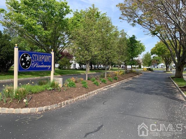 409 Draco Road Piscataway, NJ 08854 - Photo 2 of 28 a sign board with a play ground in the back