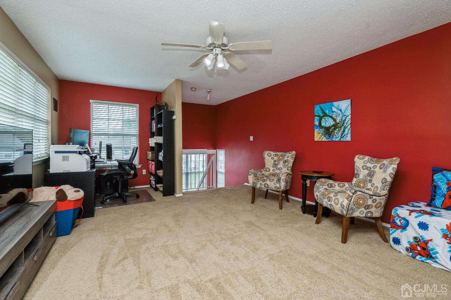 409 Draco Road Piscataway, NJ 08854 - Photo 23 of 28 a bed room with furniture and a chandelier