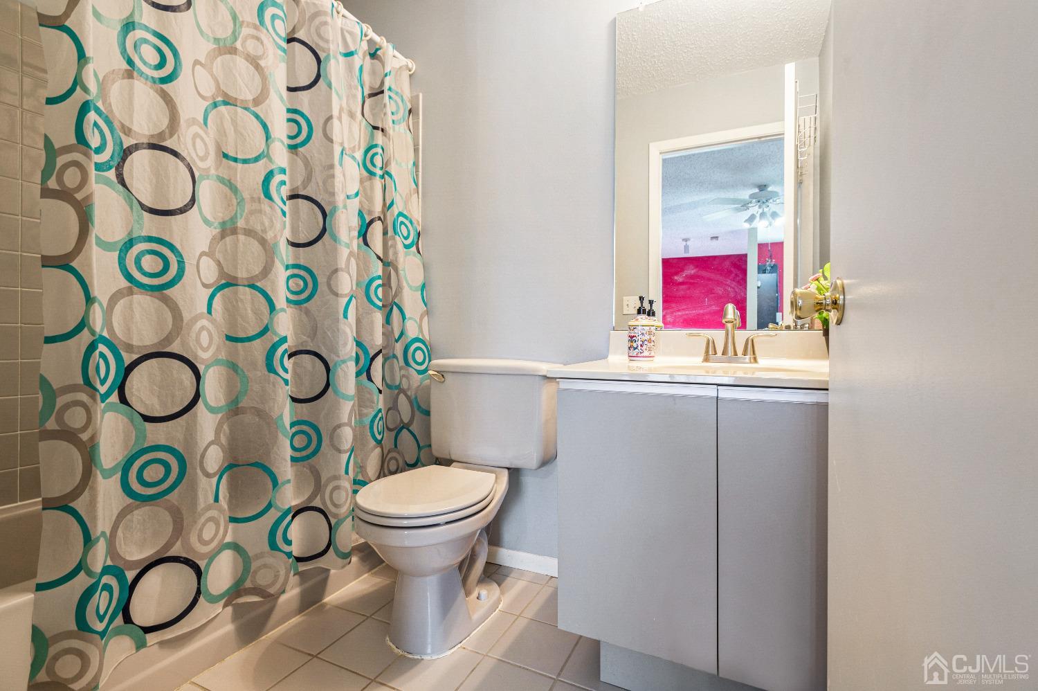 409 Draco Road Piscataway, NJ 08854 - Photo 24 of 28 a bathroom with a toilet and a shower curtain