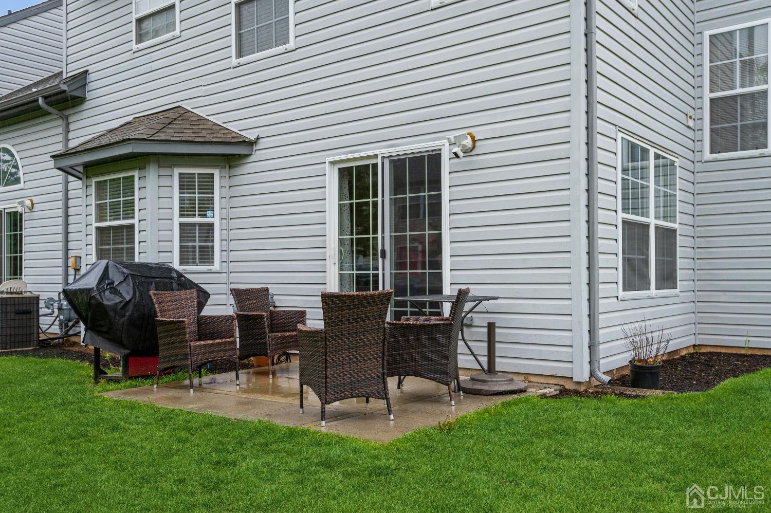 409 Draco Road Piscataway, NJ 08854 - Photo 25 of 28 a view of a house with a backyard and chairs