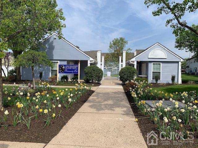 409 Draco Road Piscataway, NJ 08854 - Photo 27 of 28 a front view of a house with a garden