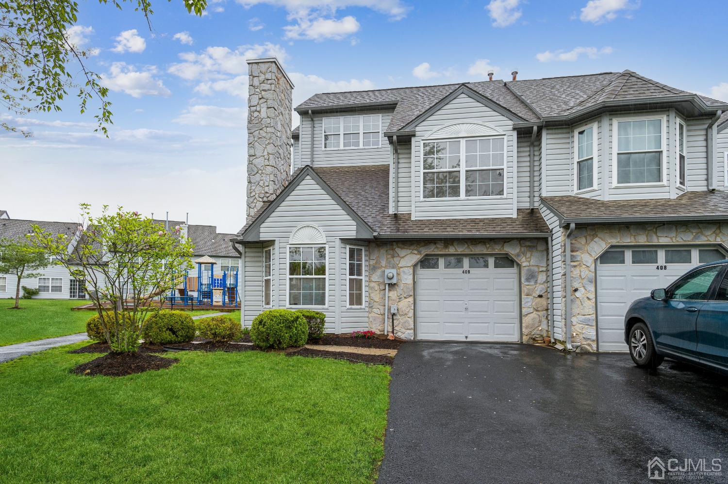 409 Draco Road Piscataway, NJ 08854 - Photo 4 of 28 a front view of a house with a garden and plants