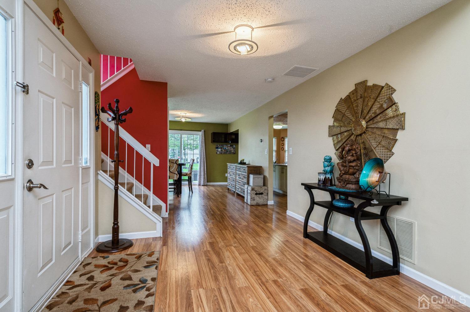 409 Draco Road Piscataway, NJ 08854 - Photo 5 of 28 a view of a livingroom with furniture and wooden floor