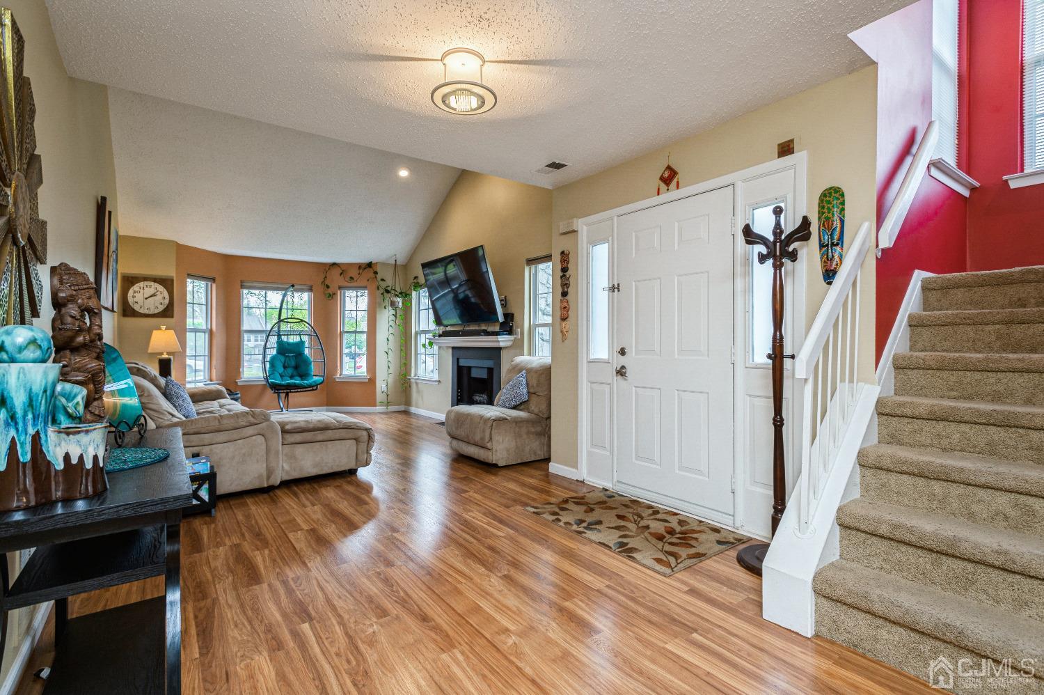 409 Draco Road Piscataway, NJ 08854 - Photo 6 of 28 a living room with furniture and a fireplace