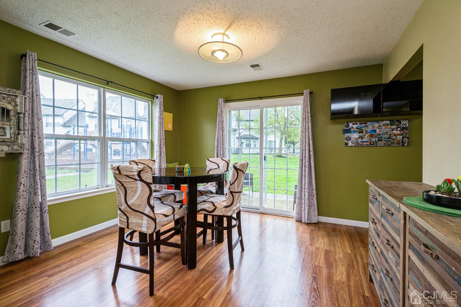 409 Draco Road Piscataway, NJ 08854 - Photo 10 of 28 a view of a dining room with furniture window and wooden floor