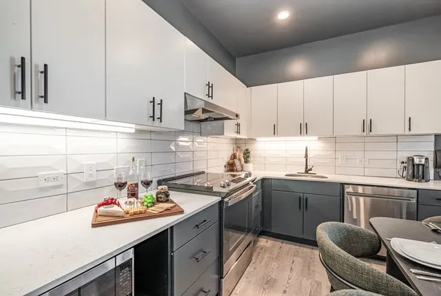 a living room with furniture and a rug