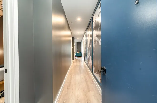 a bathroom with a glass shower door