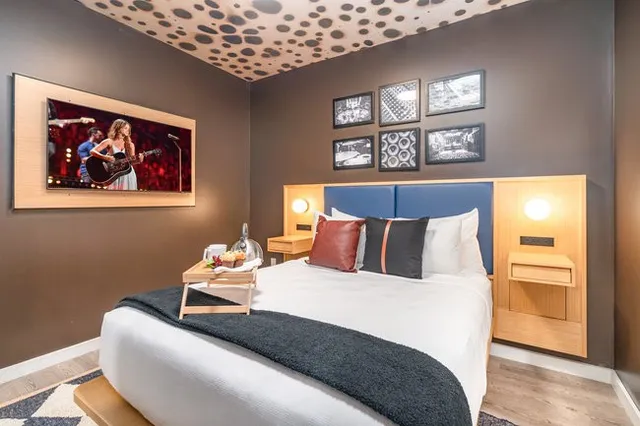 a living room with furniture a table and a large window