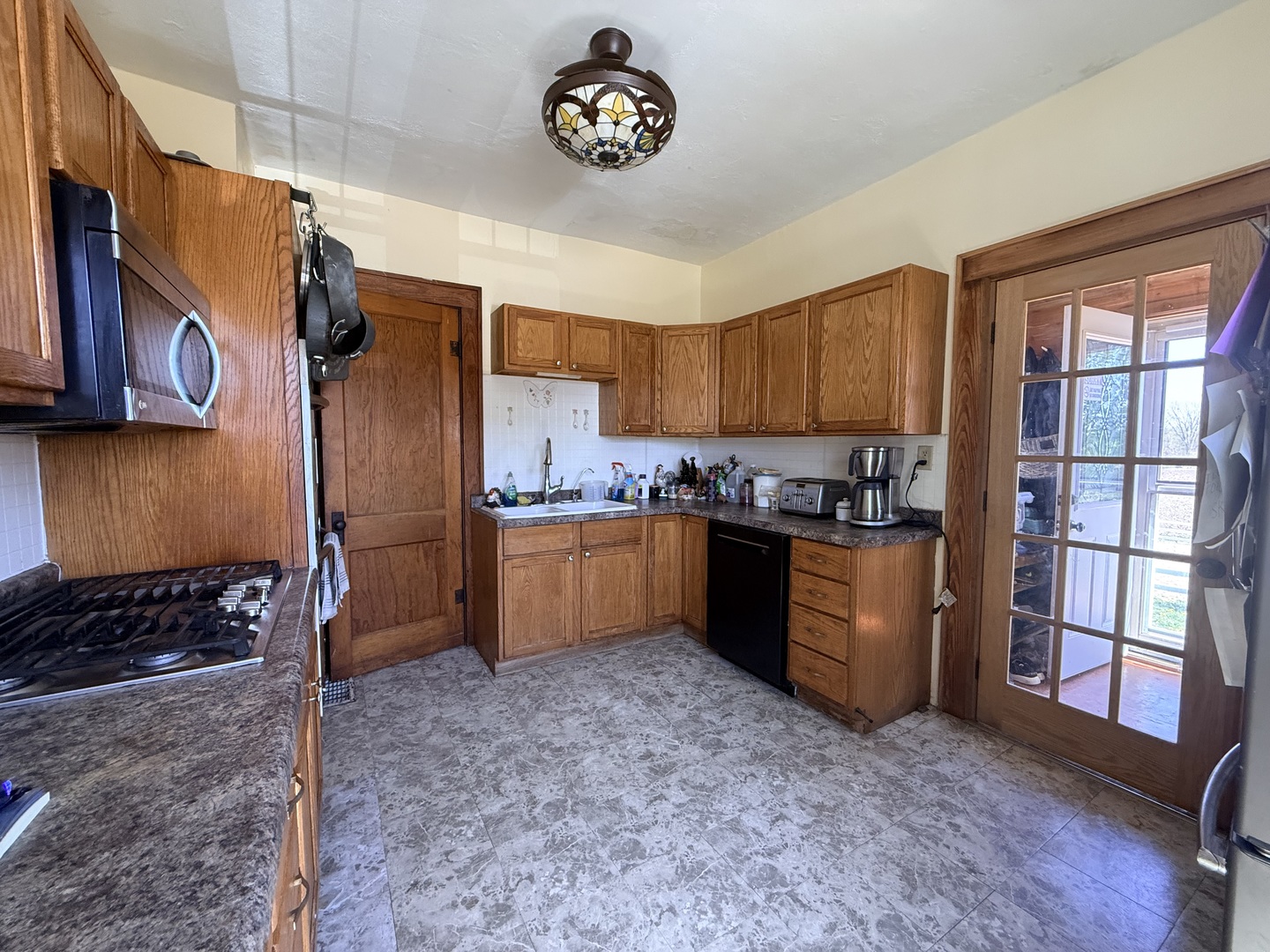 1801 Lee Center Road Amboy, IL 61310 - Photo 12 of 54 a kitchen with stainless steel appliances granite countertop a stove a sink and a refrigerator