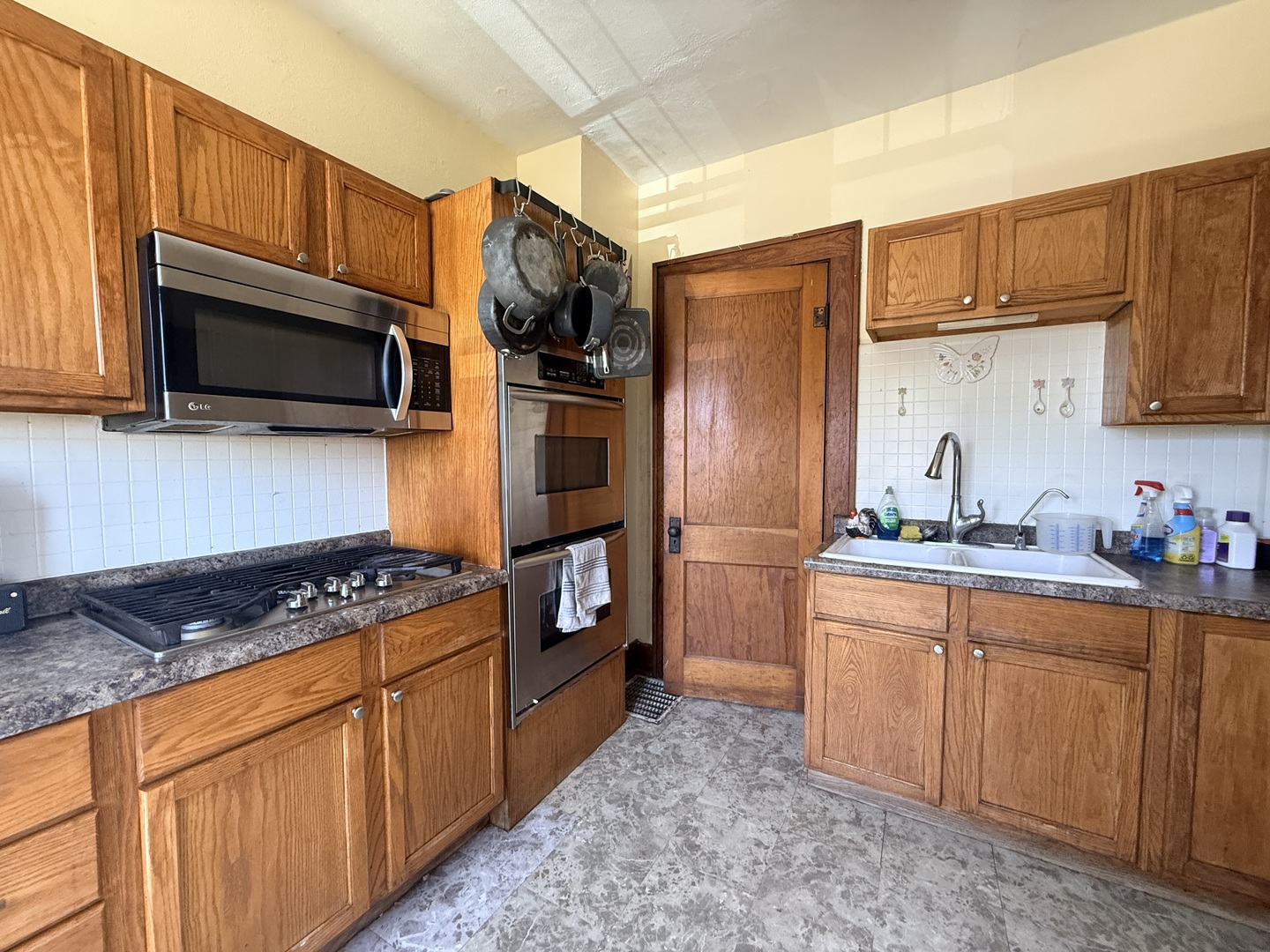 1801 Lee Center Road Amboy, IL 61310 - Photo 13 of 54 a kitchen with stainless steel appliances granite countertop a stove refrigerator sink and microwave