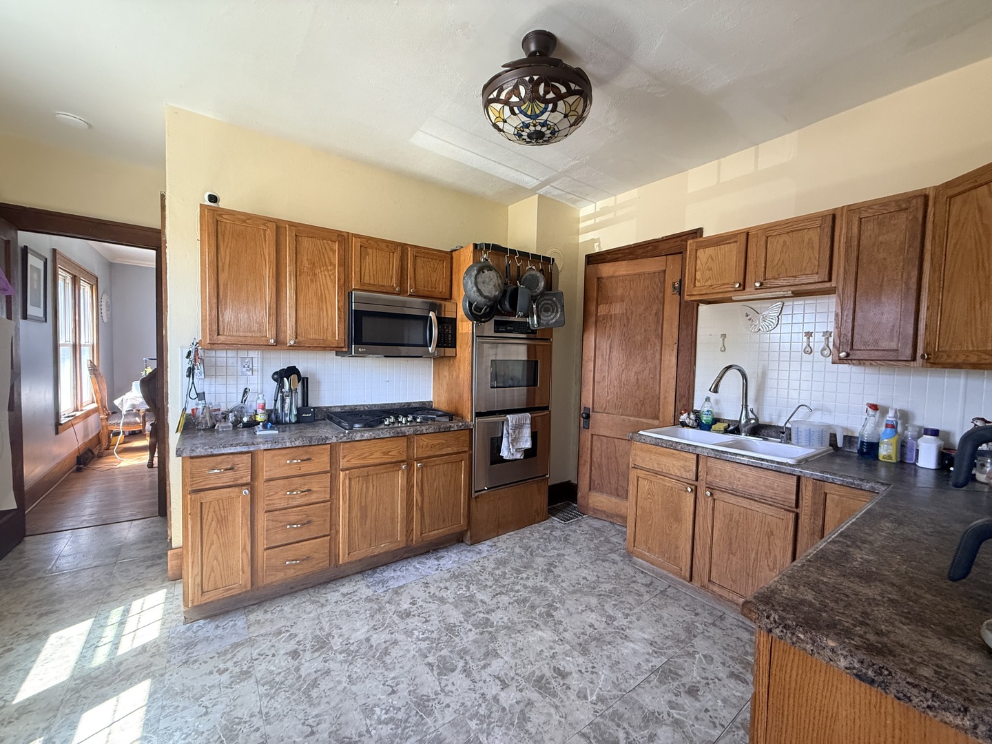1801 Lee Center Road Amboy, IL 61310 - Photo 14 of 54 a kitchen with stainless steel appliances granite countertop a sink stove and refrigerator