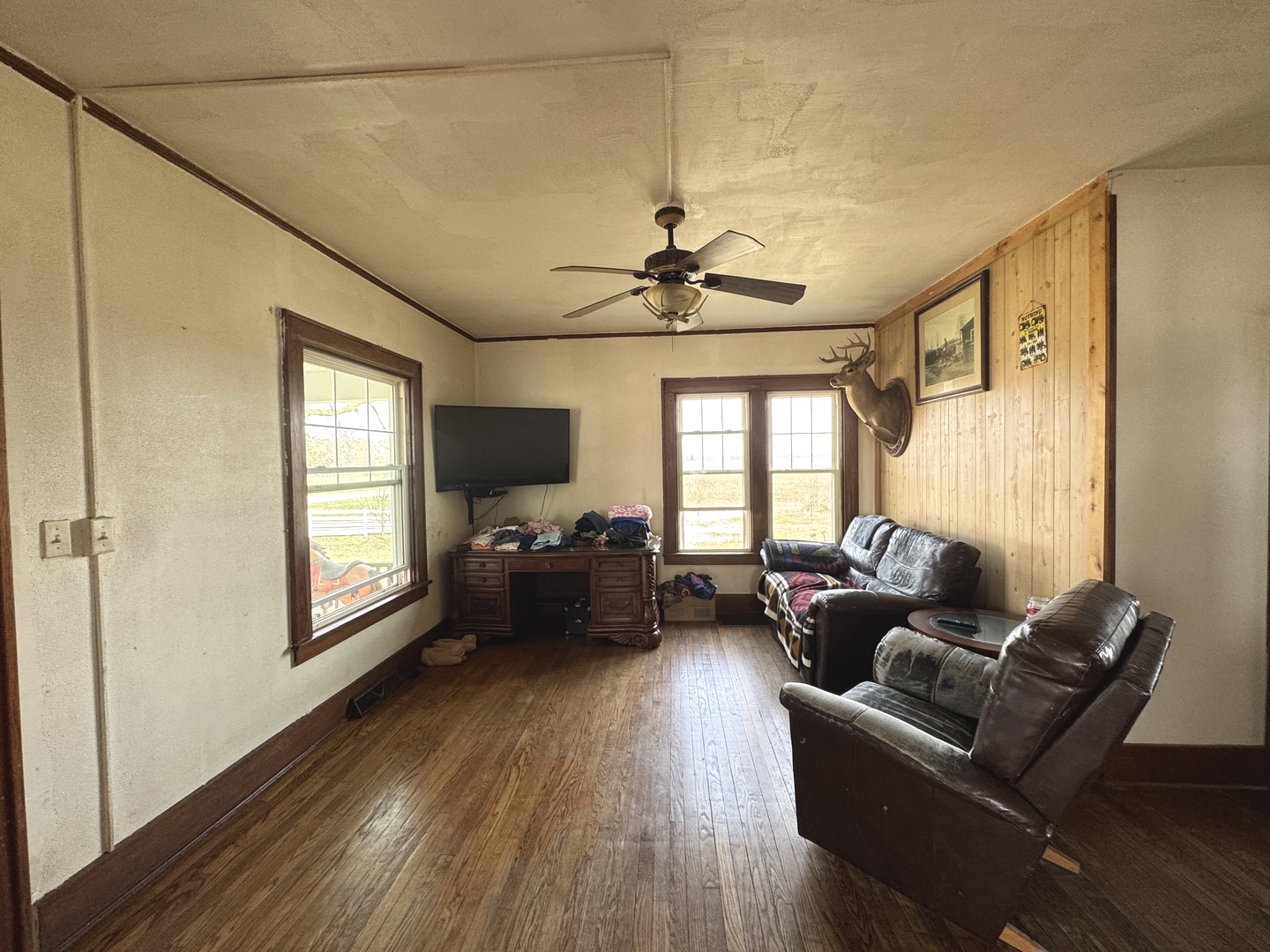 1801 Lee Center Road Amboy, IL 61310 - Photo 19 of 54 a living room with furniture wooden floor and a window