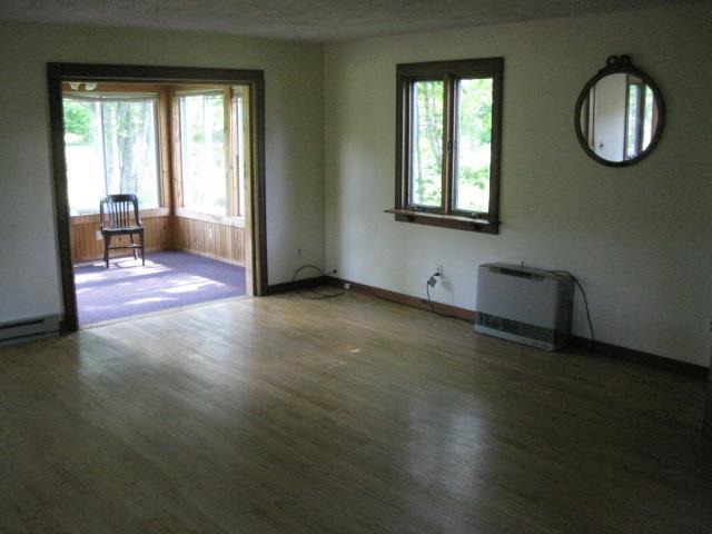 194 Weeks Mills Road South China, ME 04358 - Photo 13 of 27 Living Room with Rinnai heater and...