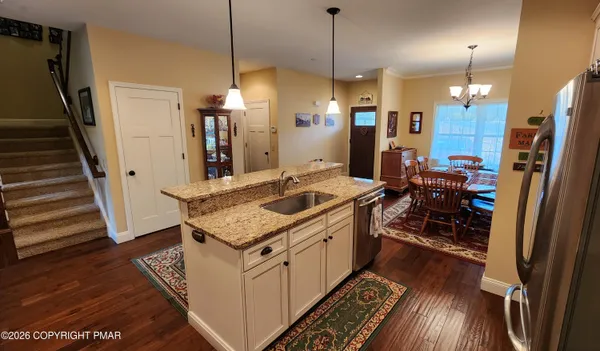 a very nice looking room with wooden floor and furniture