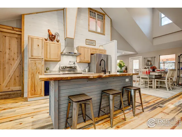 a view of kitchen with cabinets and wooden floor