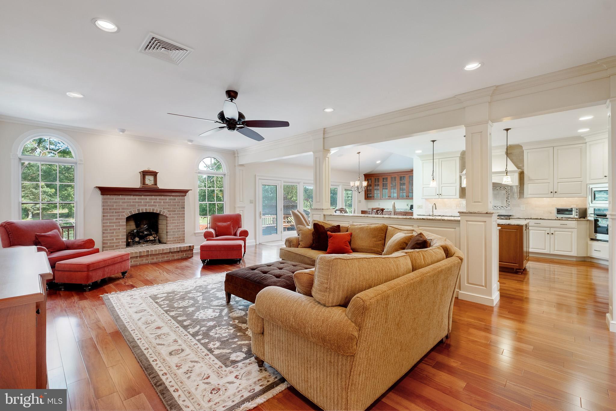 702 Commonwealth Drive Moorestown, NJ 08057 - Photo 12 of 34 a living room with furniture wooden floor and a fireplace