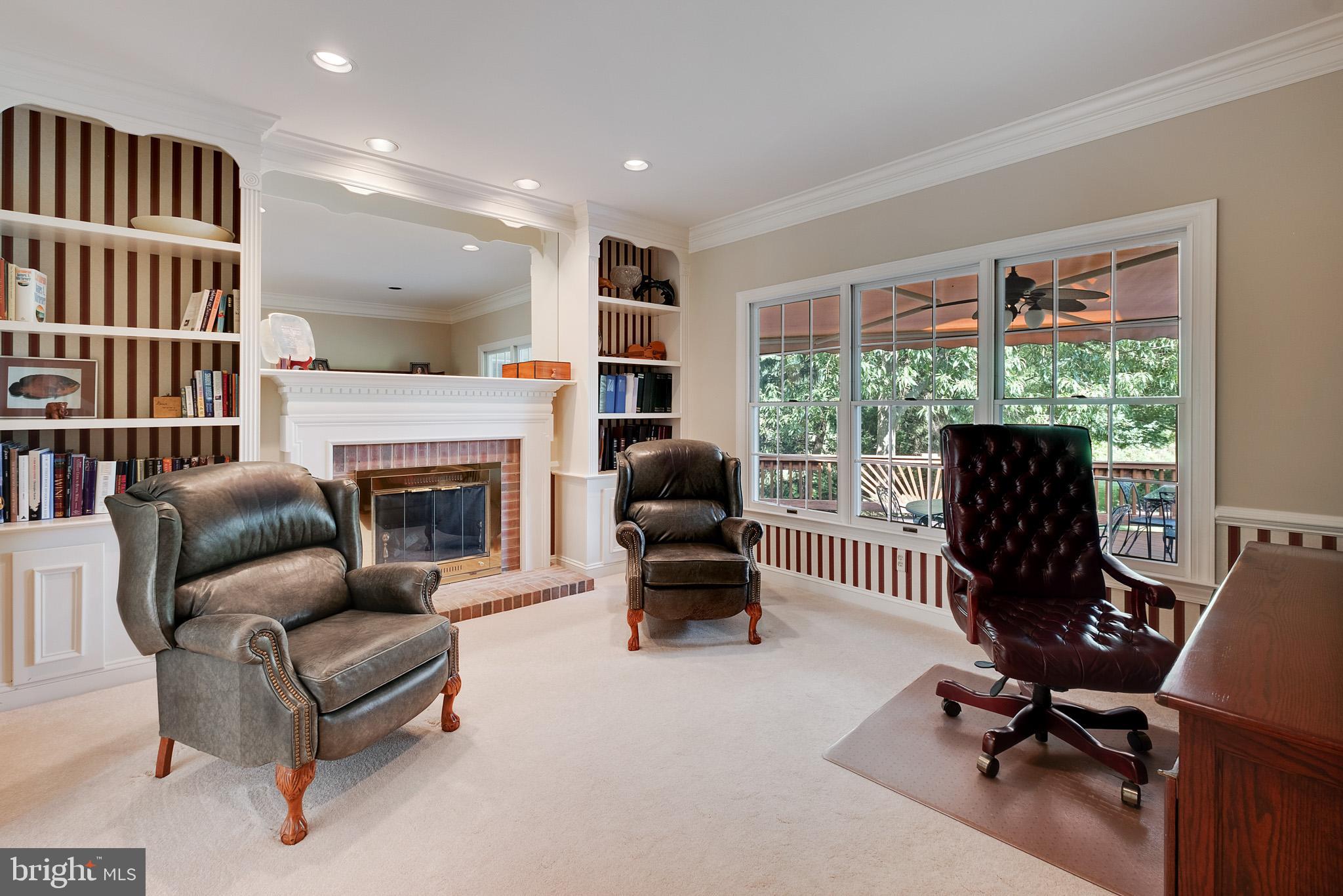 702 Commonwealth Drive Moorestown, NJ 08057 - Photo 17 of 34 a living room with furniture and a fireplace