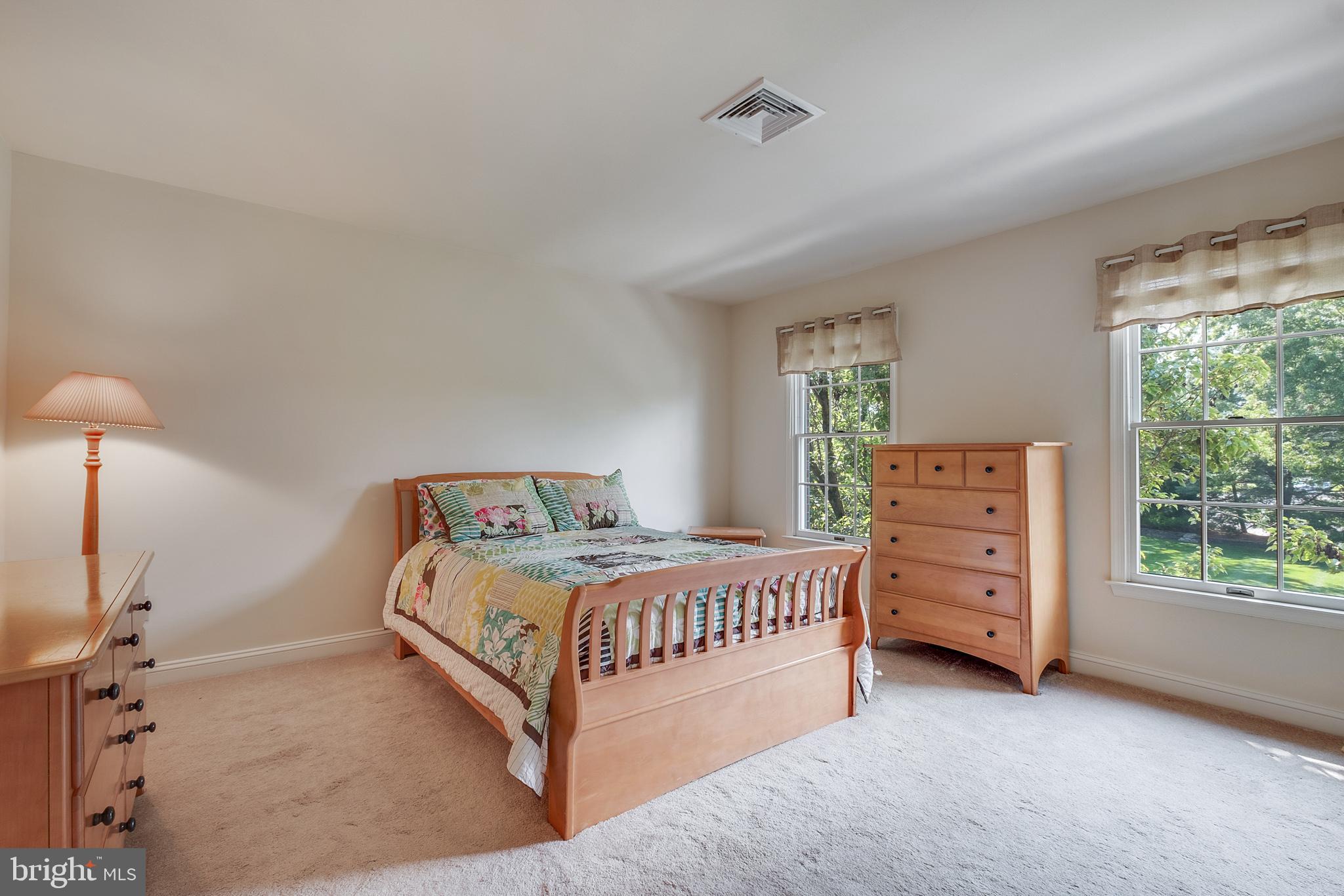 702 Commonwealth Drive Moorestown, NJ 08057 - Photo 26 of 34 a bedroom with a bed and a dresser