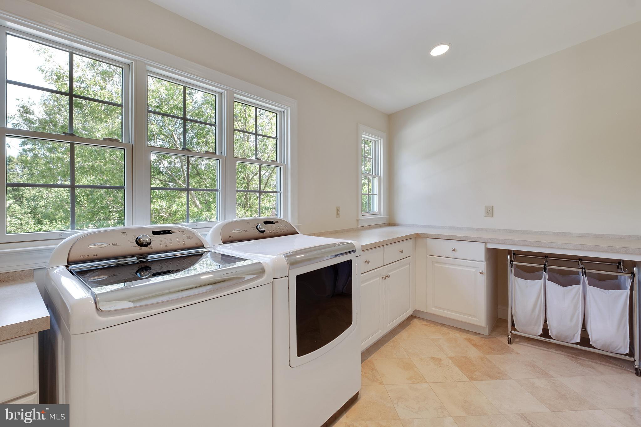 702 Commonwealth Drive Moorestown, NJ 08057 - Photo 28 of 34 a view of washer and dryer with kitchen countertops
