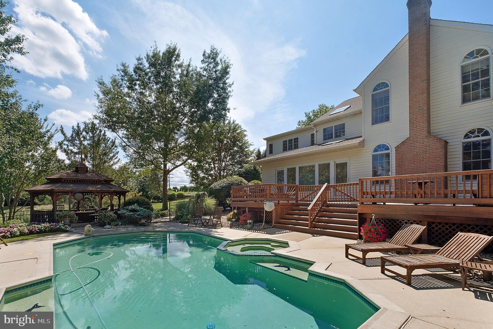 702 Commonwealth Drive Moorestown, NJ 08057 - Photo 5 of 34 a view of a house with swimming pool and sitting area