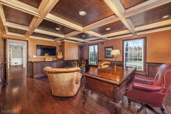 a spacious bathroom with a granite countertop sink a mirror and a bathtub
