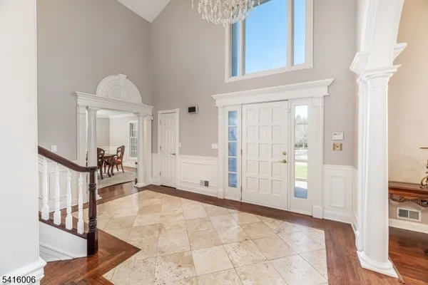 a view of staircase with fireplace and a rug