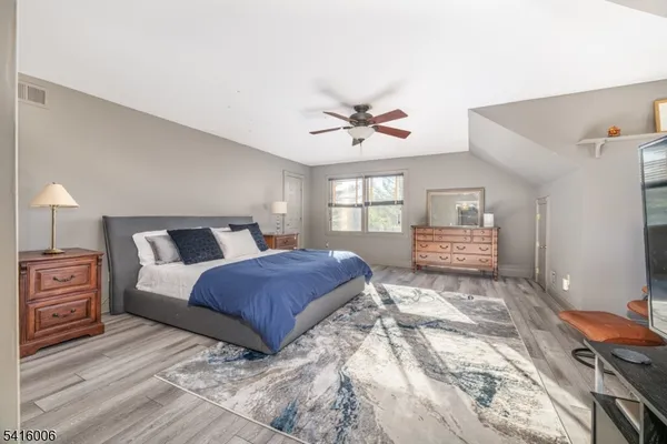 a bathroom with a sink double vanity and a toilet