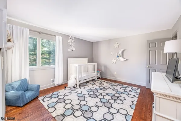 a view of a table and chairs under an umbrella