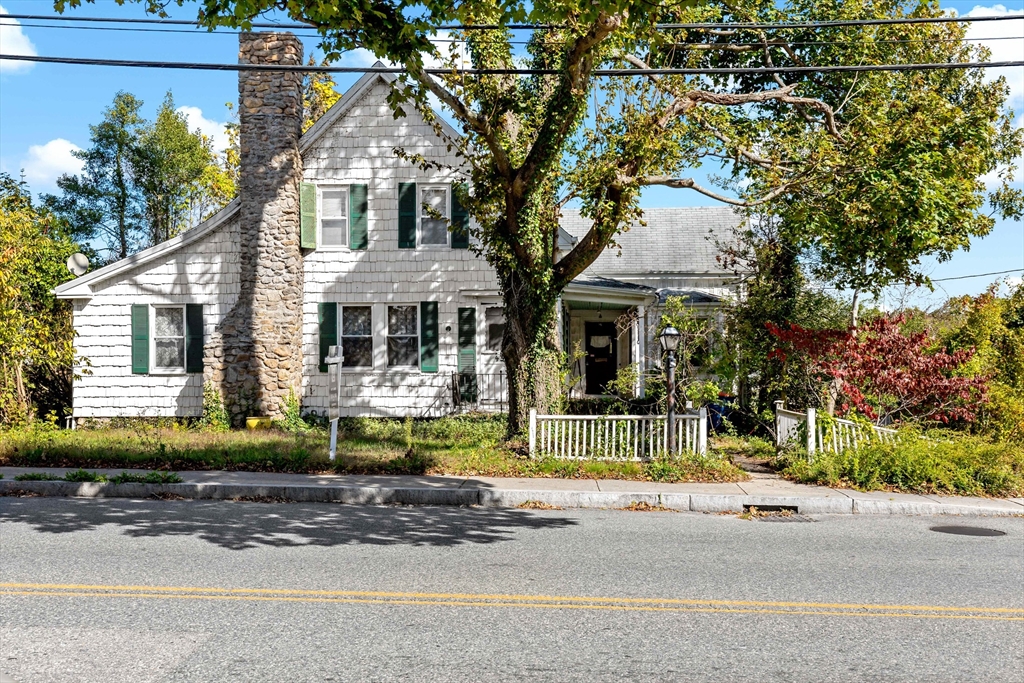 437 Main Street Wareham, MA 02571 - Photo 1 of 25 front view of a house with a small yard