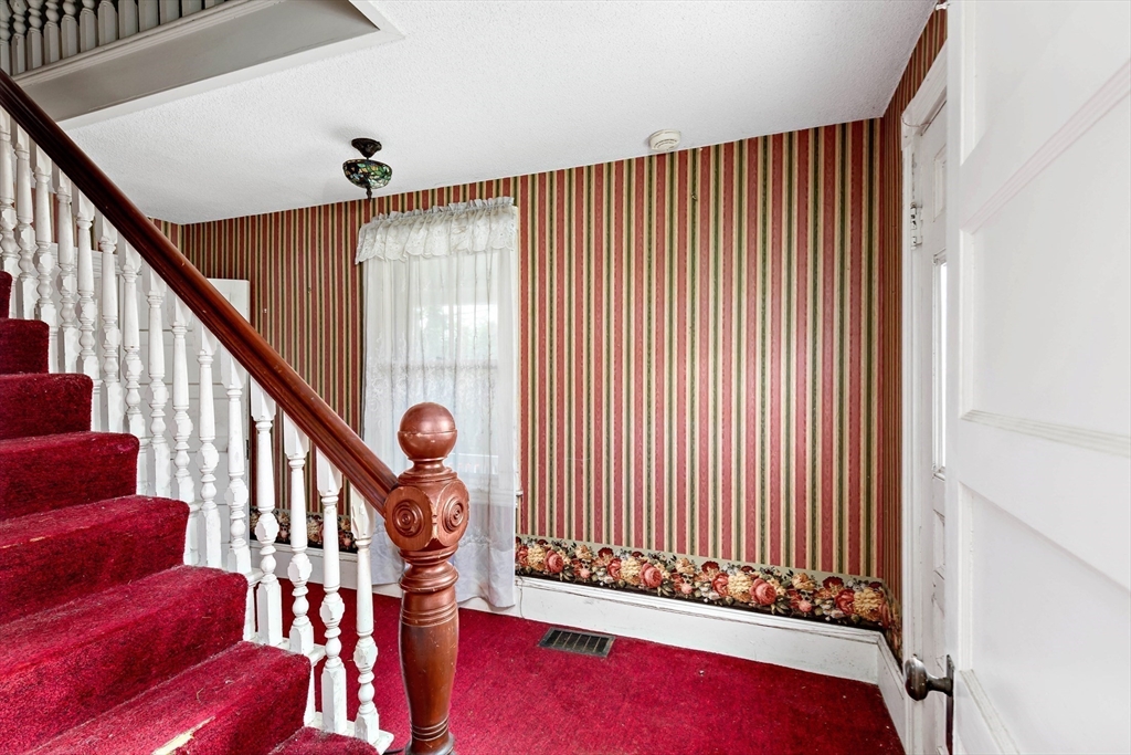 437 Main Street Wareham, MA 02571 - Photo 14 of 25 a view of a livingroom with furniture and staircase