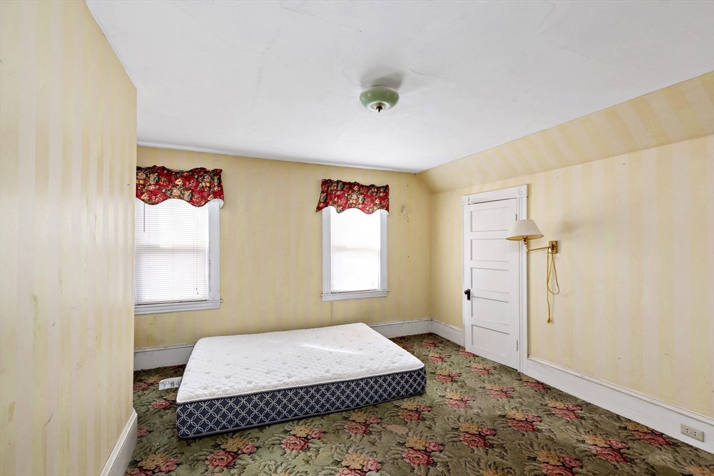 437 Main Street Wareham, MA 02571 - Photo 19 of 25 a bedroom with a bed and a window