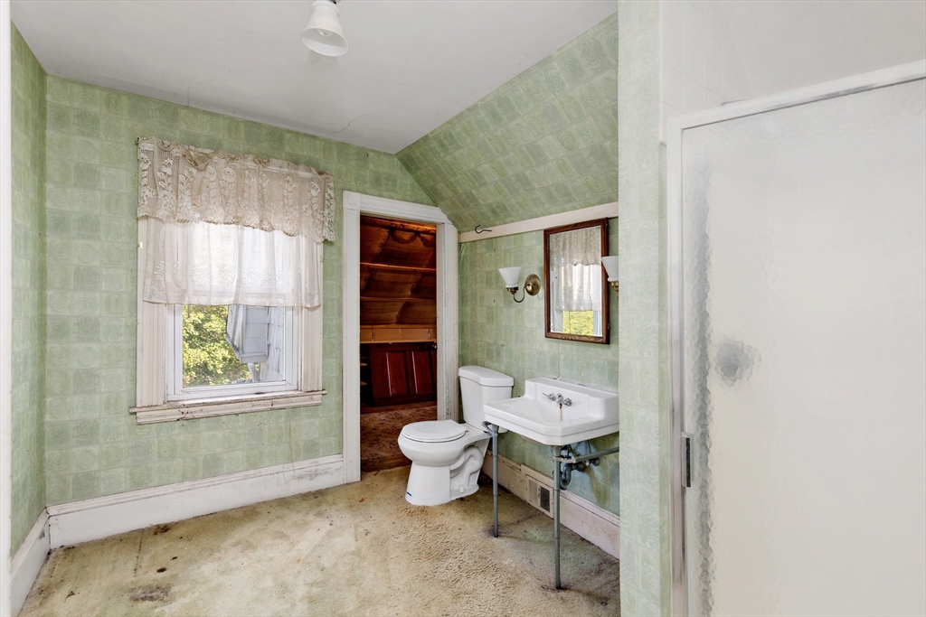 437 Main Street Wareham, MA 02571 - Photo 22 of 25 a bathroom with a toilet sink and a window