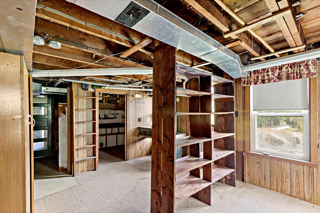 437 Main Street Wareham, MA 02571 - Photo 24 of 25 a view of walk in closet with empty racks