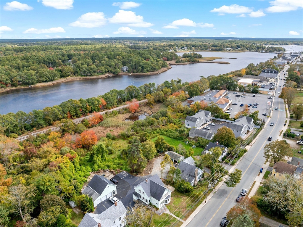 437 Main Street Wareham, MA 02571 - Photo 4 of 25 an aerial view of a city with lots of residential buildings lake and ocean view