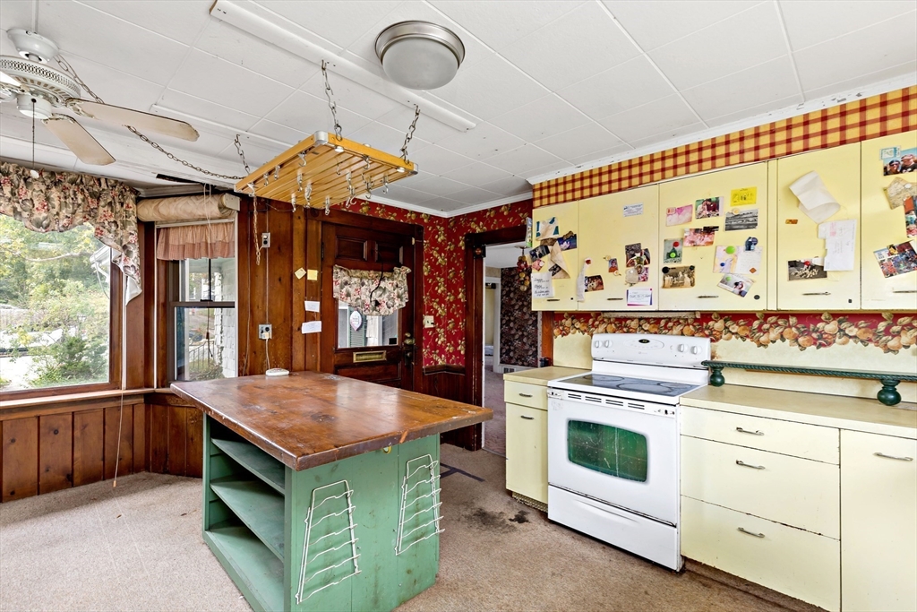 437 Main Street Wareham, MA 02571 - Photo 7 of 25 a kitchen with a stove and cabinets