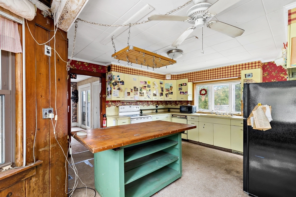 437 Main Street Wareham, MA 02571 - Photo 8 of 25 a view of a kitchen with a sink cabinets and wooden floor