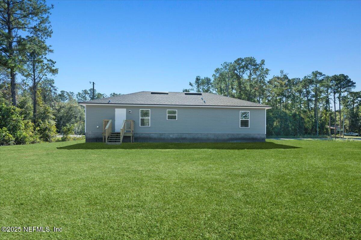 5432 Laredo Street Keystone Heights, FL 32656 - Photo 21 of 23 a view of a house with a backyard