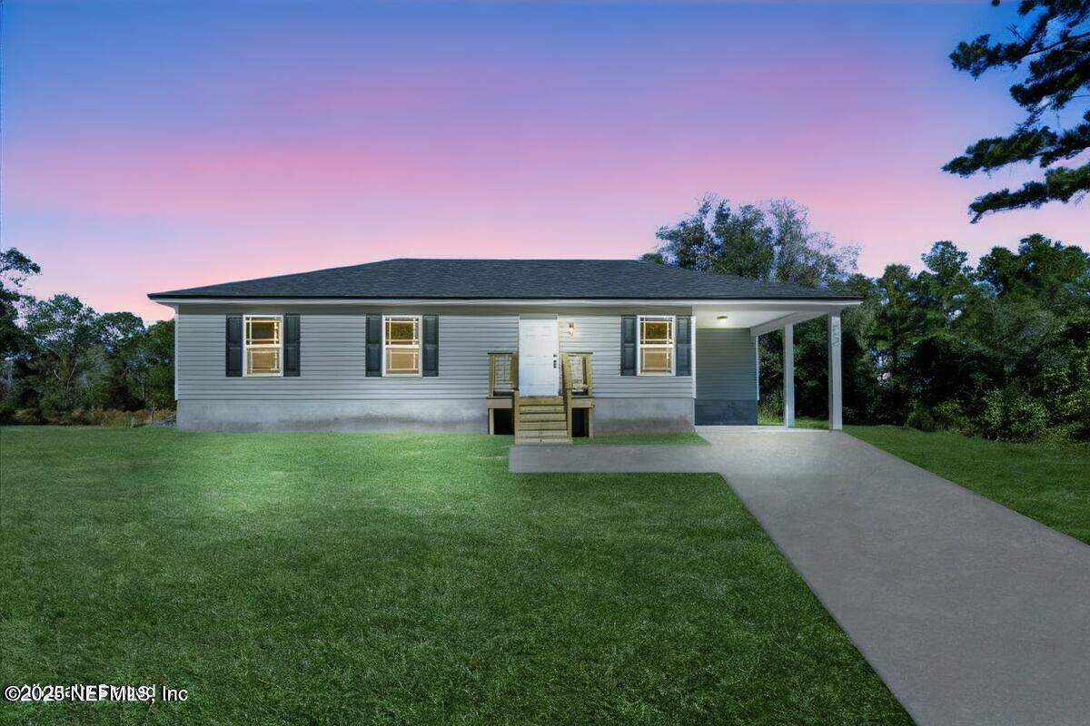 5432 Laredo Street Keystone Heights, FL 32656 - Photo 22 of 23 a front view of a house with a garden