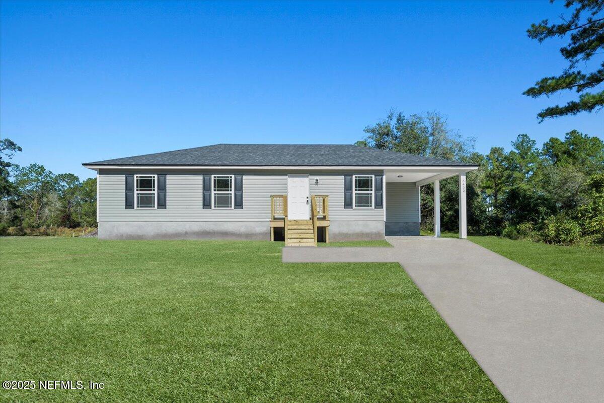 5432 Laredo Street Keystone Heights, FL 32656 - Photo 23 of 23 a front view of house with yard and green space