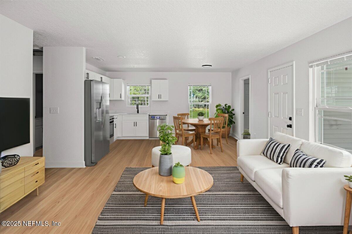 5432 Laredo Street Keystone Heights, FL 32656 - Photo 3 of 23 a living room with furniture and a flat screen tv