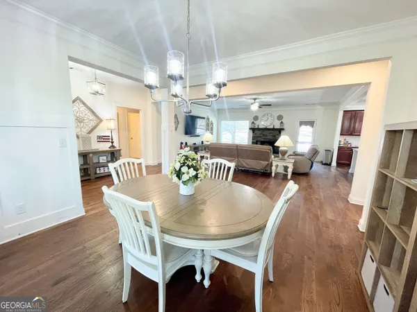 a view of entryway livingroom and hall with wooden floor