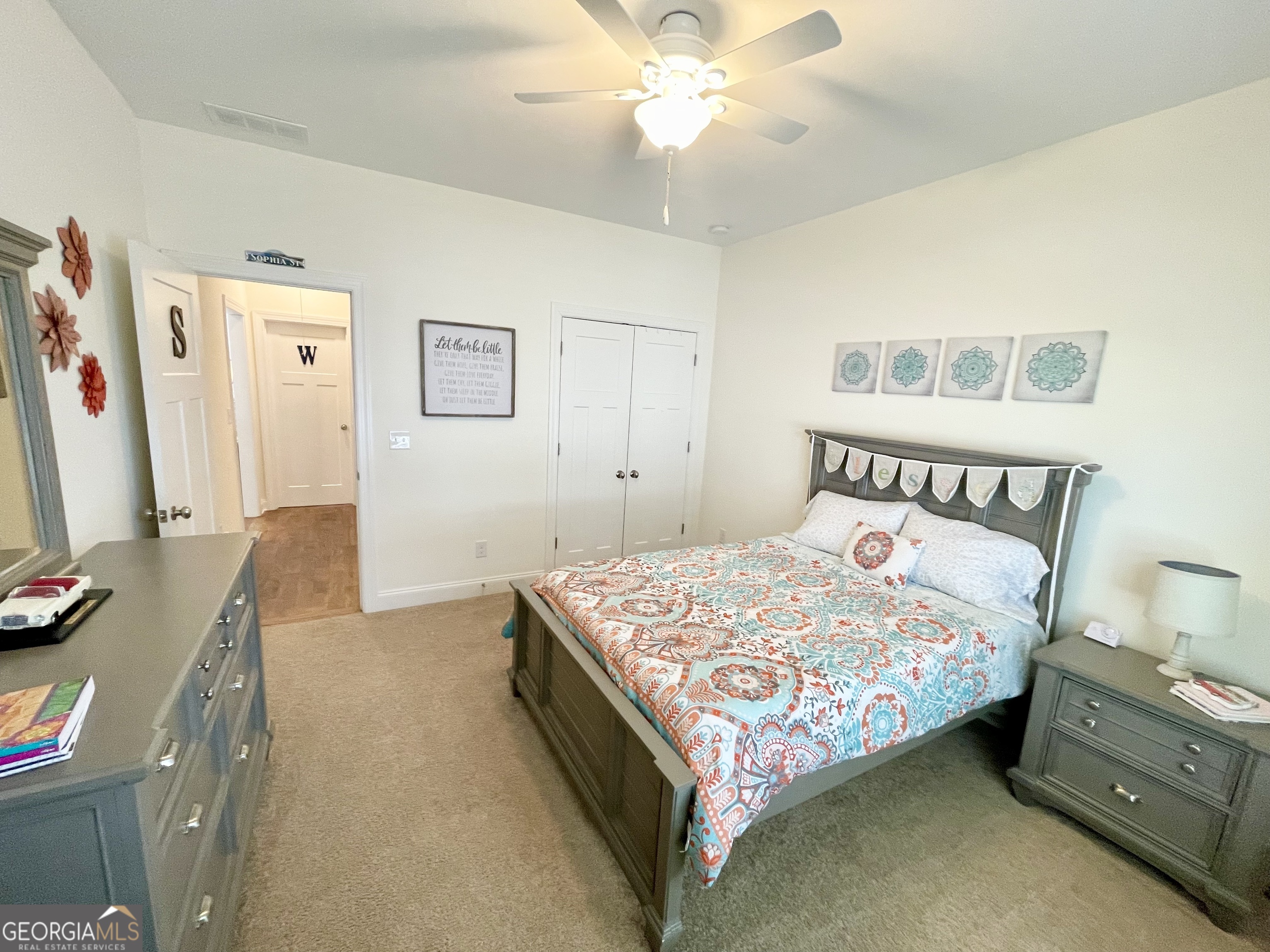 143 Spring Lake Trail White, GA 30184 - Photo 15 of 45 a bedroom with a bed and a flat tv screen on the dresser