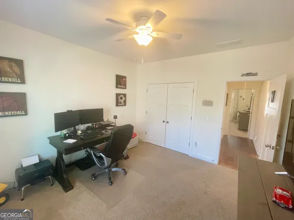 a view of a hallway and wooden floor