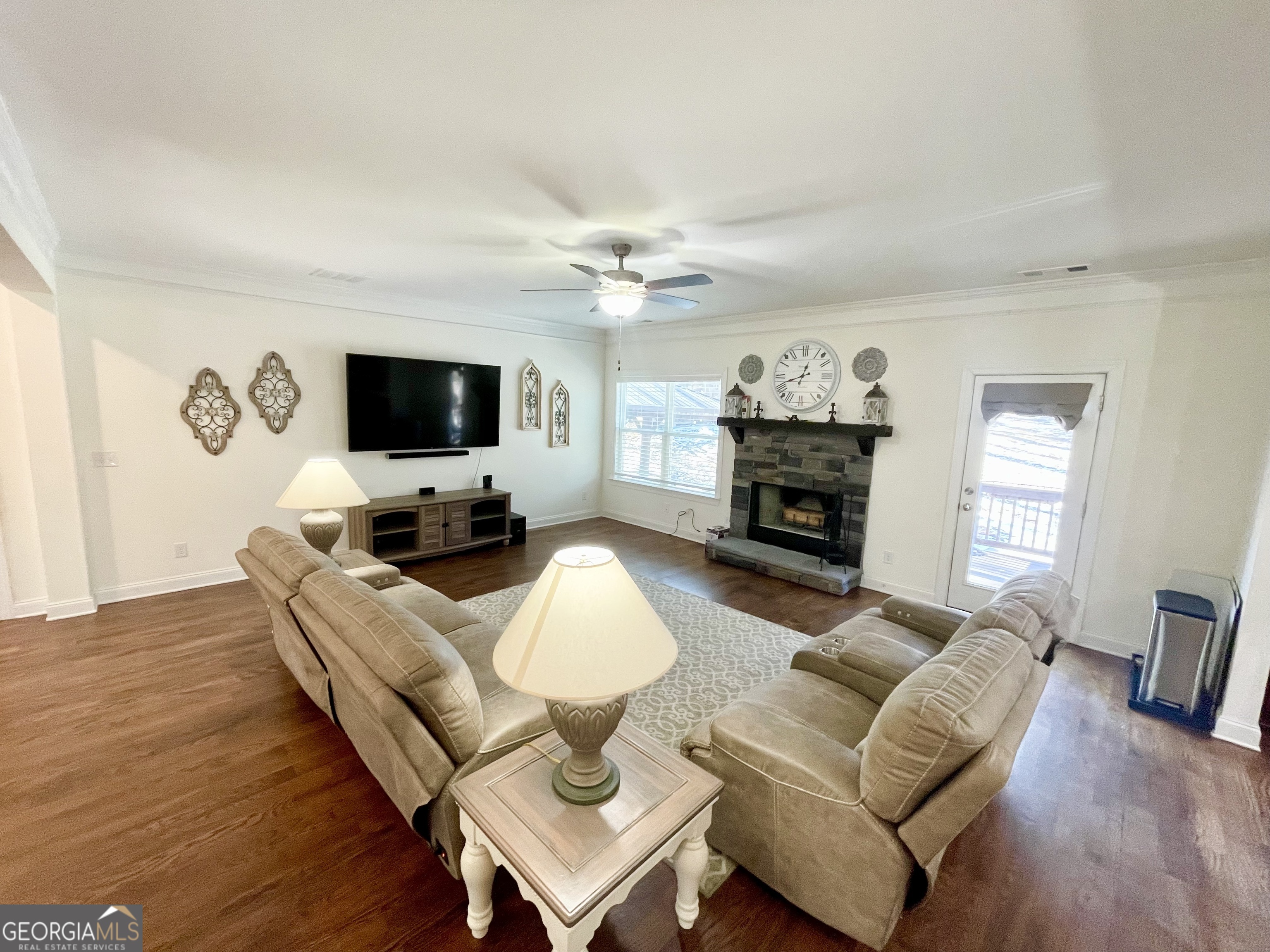 143 Spring Lake Trail White, GA 30184 - Photo 21 of 45 a living room with furniture a fireplace and a flat screen tv