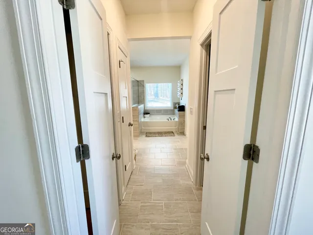 a view of a bathroom from a hallway