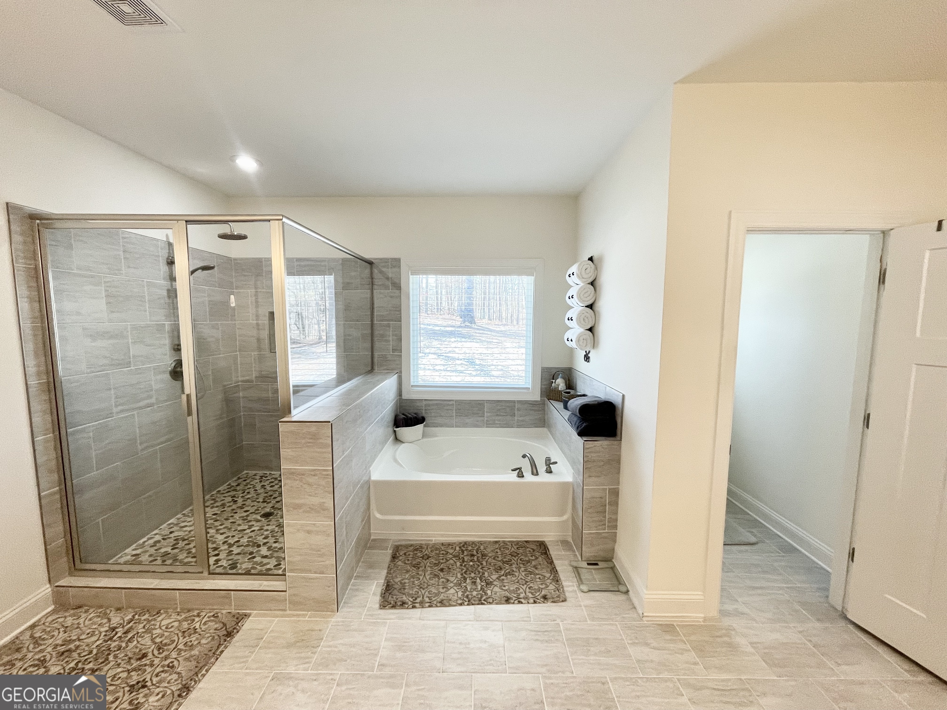 143 Spring Lake Trail White, GA 30184 - Photo 34 of 45 a bathroom with a shower and a bathtub