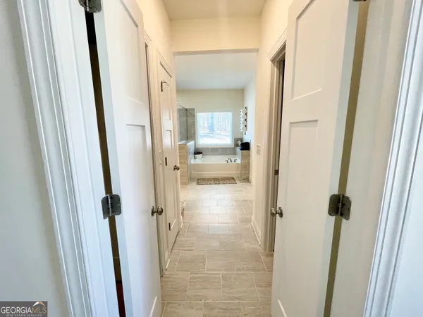 a view of a storage room with a refrigerator