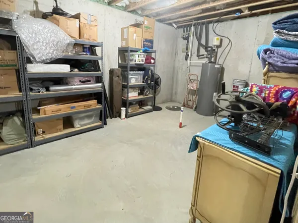 a view of a garage with clothes and shoes