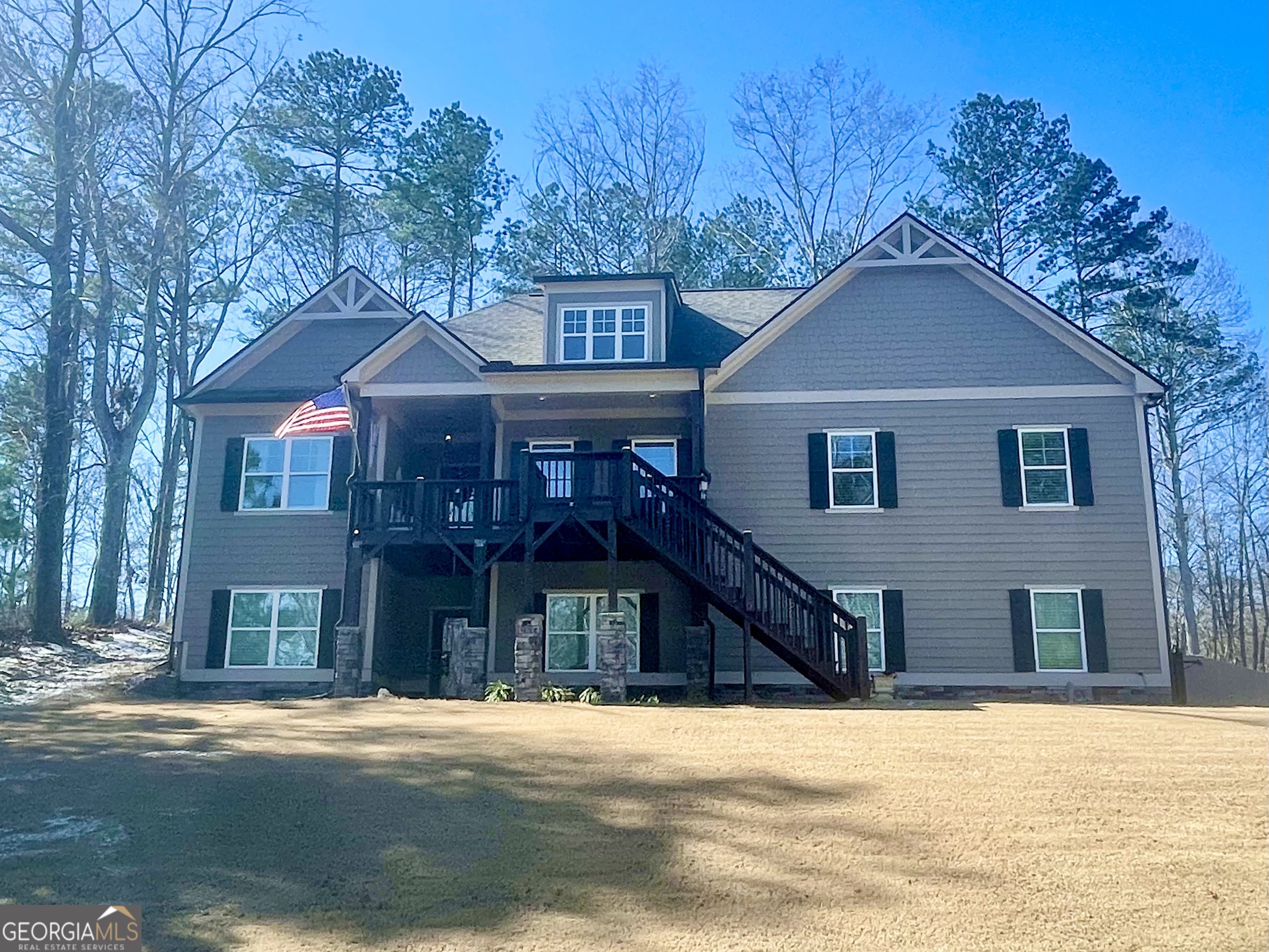 143 Spring Lake Trail White, GA 30184 - Photo 4 of 45 a front view of a house with a yard and garage