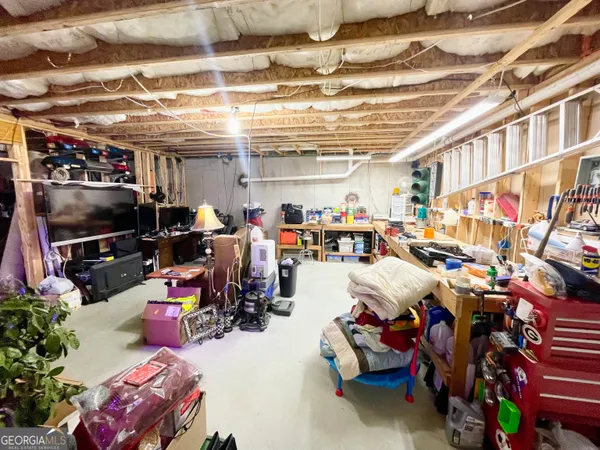 a view of a house with a yard and garage